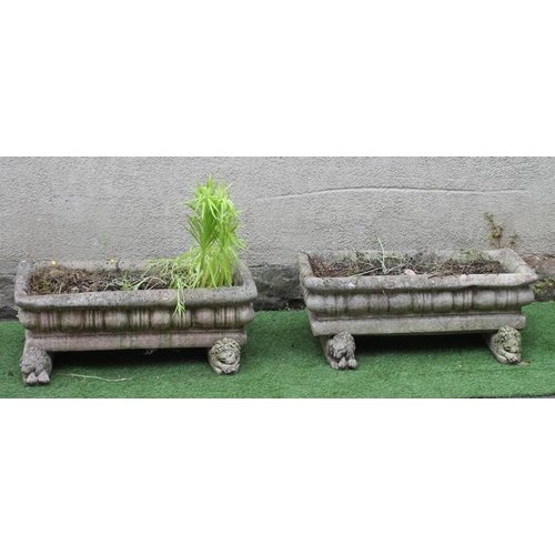 472 - A PAIR OF COMPOSITION STONE JARDINIERES of oblong form with everted rims and cushion moulded sides, ... 