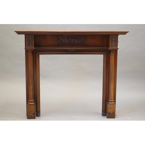 485 - A MAHOGANY FIRE SURROUND, early 20th century, the moulded shelf raised on turned fluted columns head... 