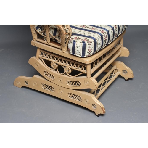 486 - A HEYWOOD & WAKEFIELD STYLE GARDEN ROOM PLATFORM ROCKER, the mildly arched wicker back woven with a ... 