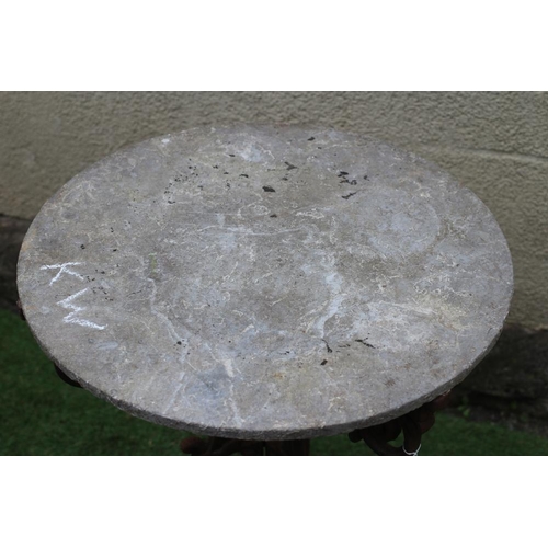 490 - A VICTORIAN CAST IRON TABLE with associated sandstone circular top, the triform scrolling foliate ba... 