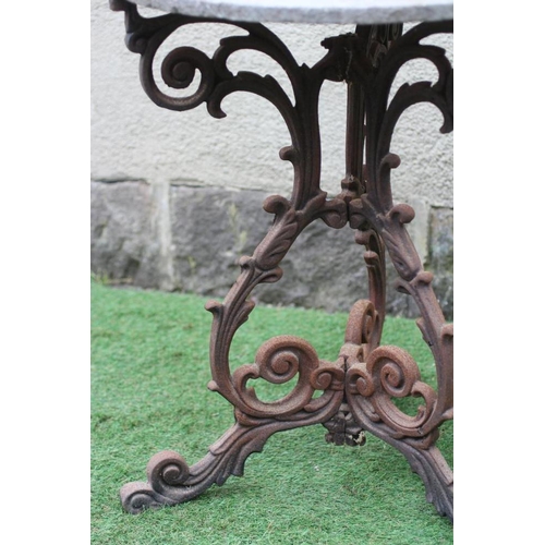 490 - A VICTORIAN CAST IRON TABLE with associated sandstone circular top, the triform scrolling foliate ba... 