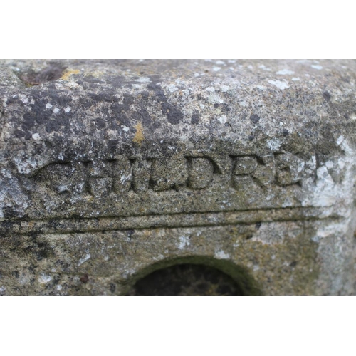 500 - A SUBSTANTIAL SANDSTONE PLANTER, 19th century, of deep circular form carved with a band of flowerhea... 