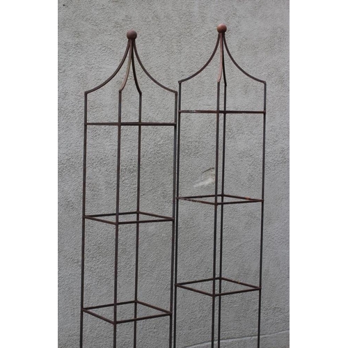 505 - A PAIR OF WROUGHT IRON PLANT OBELISKS of square form, the pyramidal top with ball finial, rust patin... 