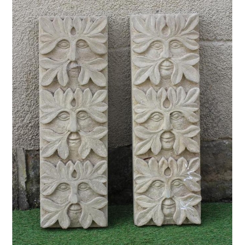 509 - A PAIR OF CARVED SANDSTONE GREEN MAN WALL PANELS of oblong form each with three masks, 8