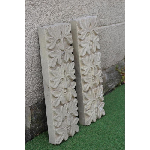 509 - A PAIR OF CARVED SANDSTONE GREEN MAN WALL PANELS of oblong form each with three masks, 8