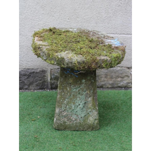 511 - A SANDSTONE BIRD FEEDER, the circular top raised on square tapering stem, 27 1/2