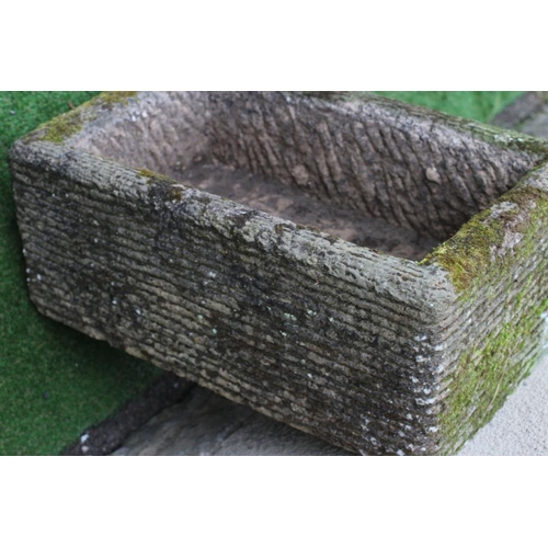 516 - A SANDSTONE TROUGH of well cut oblong form with line banding, 27 1/2