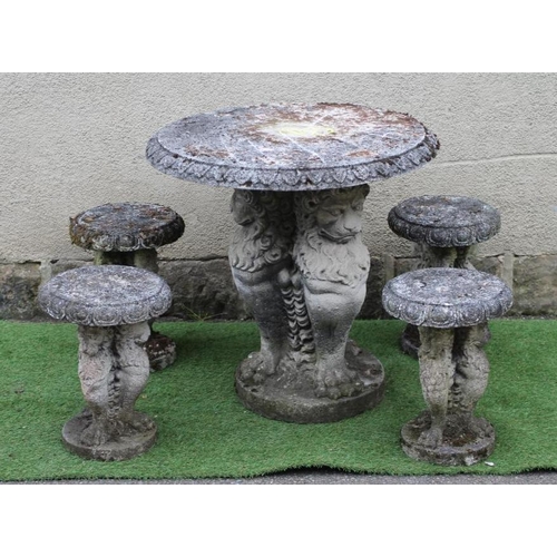 522 - A CAST STONE TABLE, the circular top with ovolu rim on lion monopodiae supports and circular base, 3... 