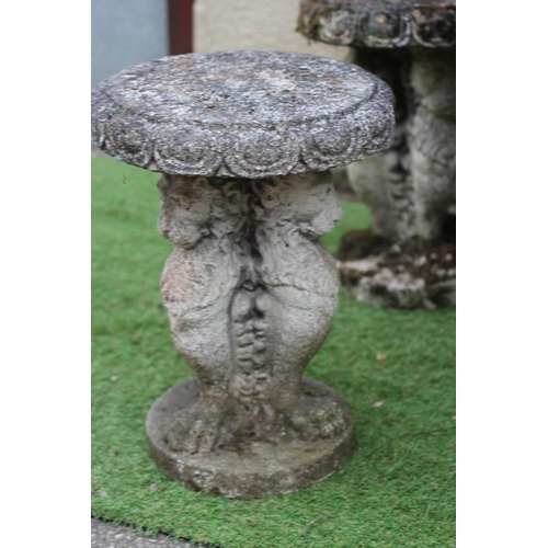 522 - A CAST STONE TABLE, the circular top with ovolu rim on lion monopodiae supports and circular base, 3... 