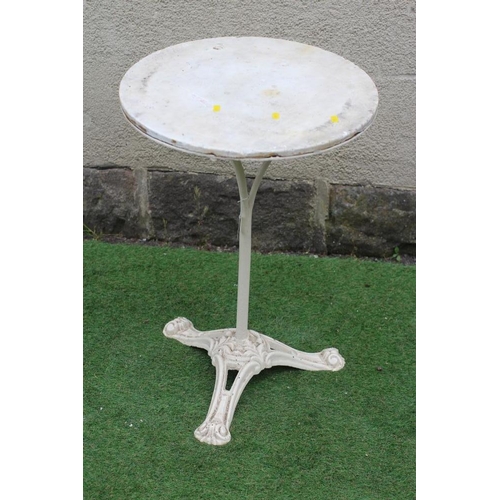 527 - A CAST IRON BISTRO TABLE, the circular white marble top on plain turned stem, raised on scrolled and... 