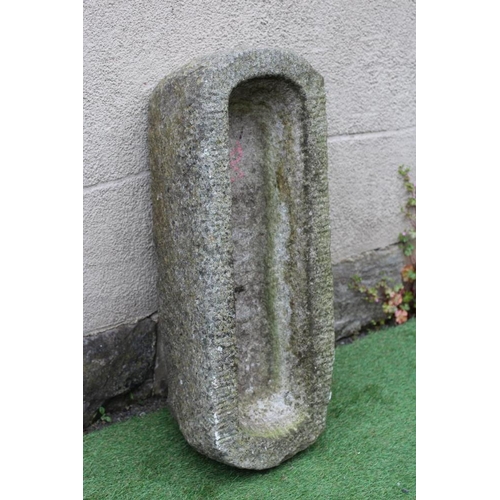 533 - A GRANITE TROUGH of well cut narrow oblong form with rounded ends, 32