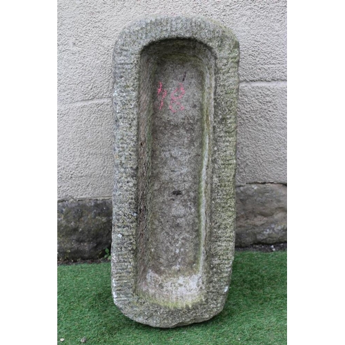 533 - A GRANITE TROUGH of well cut narrow oblong form with rounded ends, 32