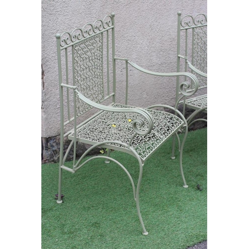 537 - A PAINTED CAST AND TUBULAR METAL TERRACE SUITE, comprising a pair of armchairs, with scroll panel ba... 