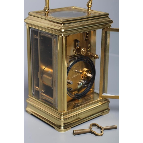 558 - A BRASS CASED CARRIAGE CLOCK, the twin barrel movement with platform escapement striking on a gong, ... 