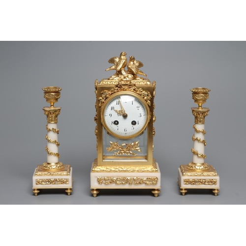 562 - A GILT METAL AND ALABASTER CLOCK GARNITURE, modern, the twin barrel movement with platform escapemen... 