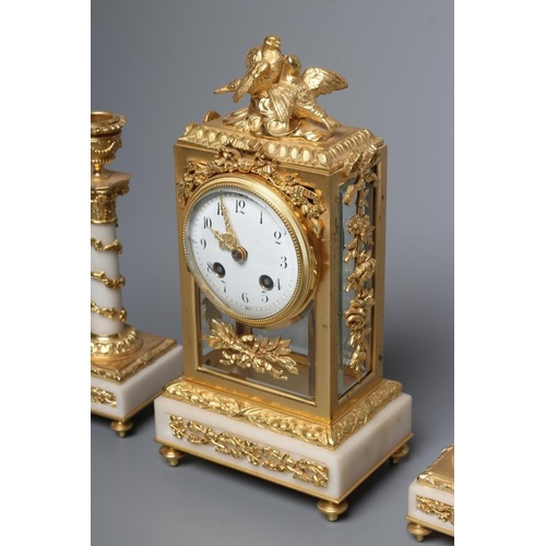 562 - A GILT METAL AND ALABASTER CLOCK GARNITURE, modern, the twin barrel movement with platform escapemen... 