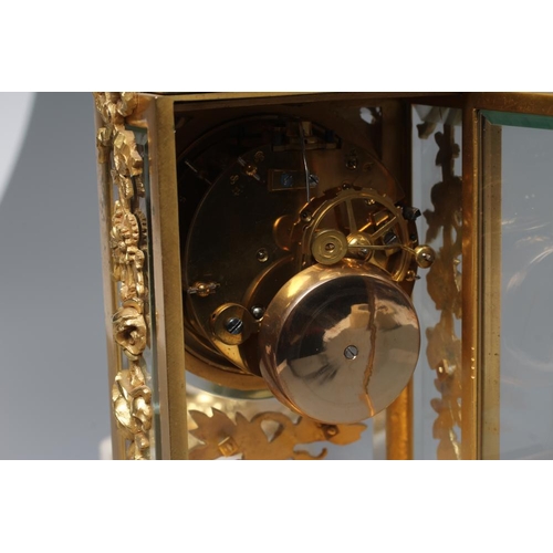 562 - A GILT METAL AND ALABASTER CLOCK GARNITURE, modern, the twin barrel movement with platform escapemen... 