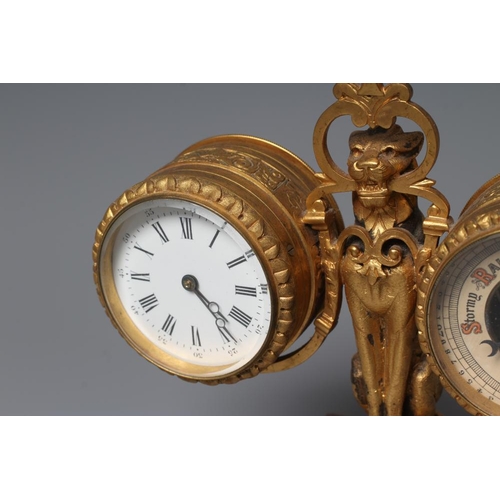 563 - A GILT METAL FIGURAL DESK COMPENDIUM, c.1900, comprising a clock and barometer suspended from a scro... 