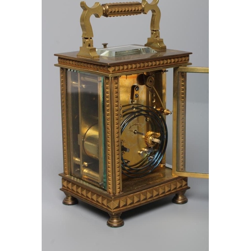 566 - A BRASS CASED CARRIAGE CLOCK, the twin barrel movement with platform escapement and repeat mechanism... 