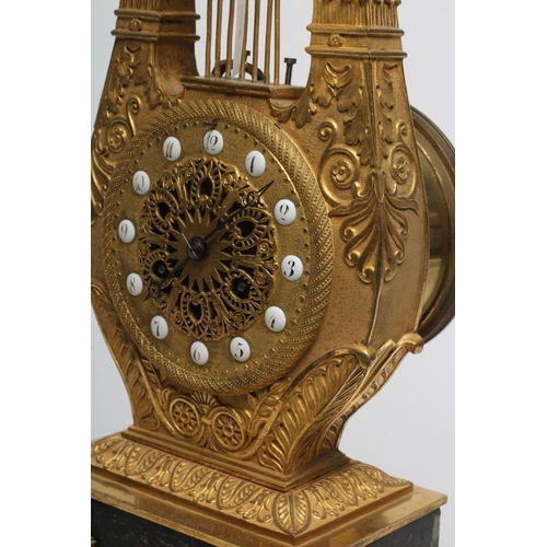 571 - A LOUIS XVI STYLE GILT METAL LYRE MANTEL CLOCK, mid 19th century, the twin barrel movement with outs... 