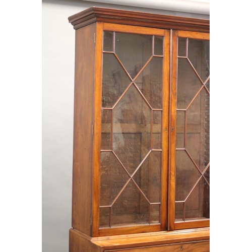 608 - A GEORGIAN MAHOGANY SECRETAIRE BOOKCASE, late 18th century, the moulded cornice over two astragal gl... 