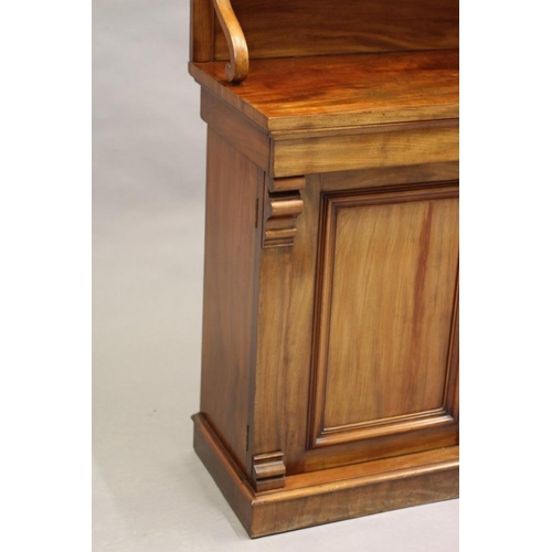 612 - A VICTORIAN MAHOGANY CREDENZA, the raised back with pedemented gallery and two graduated shelves on ... 