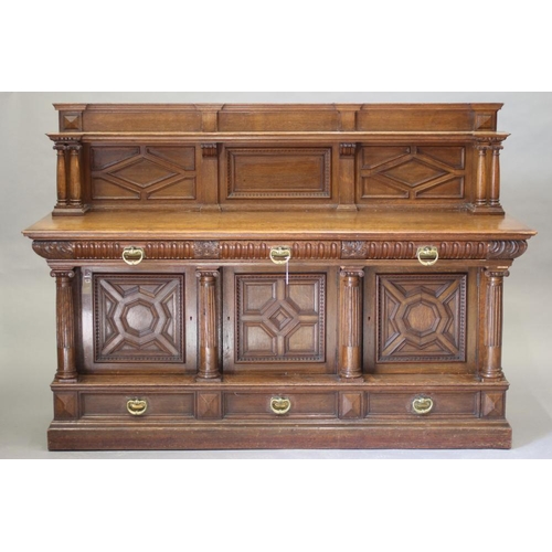 614 - A VICTORIAN CARVED OAK SIDEBOARD BY MARSH, JONES & CRIBB, LEEDS, the raised panelled back with shelf... 