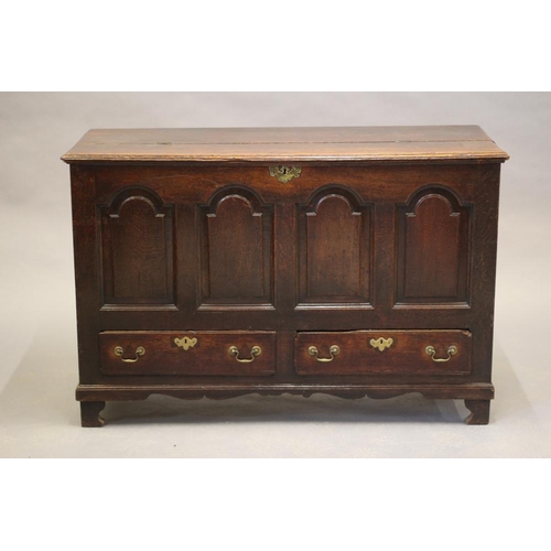 616 - A GEORGIAN OAK PANELLED CHEST, third quarter 18th century, the moulded edged split hinged lid openin... 