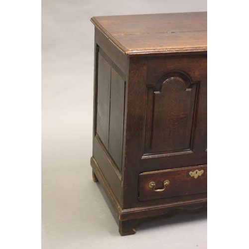 616 - A GEORGIAN OAK PANELLED CHEST, third quarter 18th century, the moulded edged split hinged lid openin... 