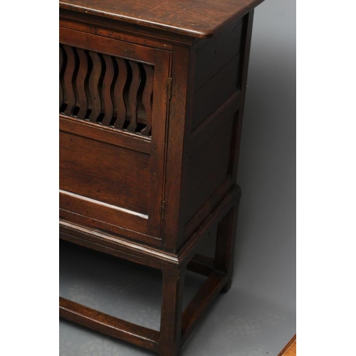 619 - A JOINED OAK LIVERY CUPBOARD, early 18th century and later, the moulded edged top over a pair of twi... 