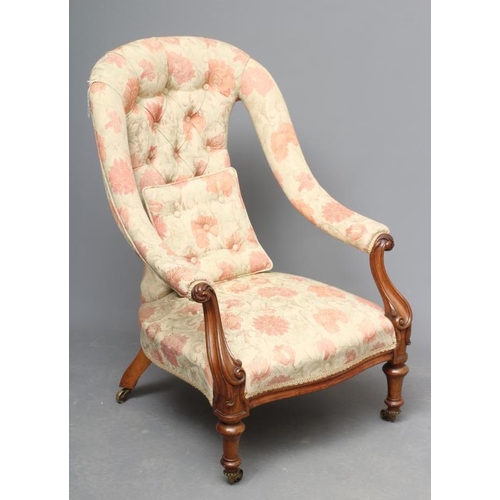 623 - A VICTORIAN WALNUT FRAMED SALON CHAIR, upholstered in a pale cream and salmon weave, arched waisted ... 