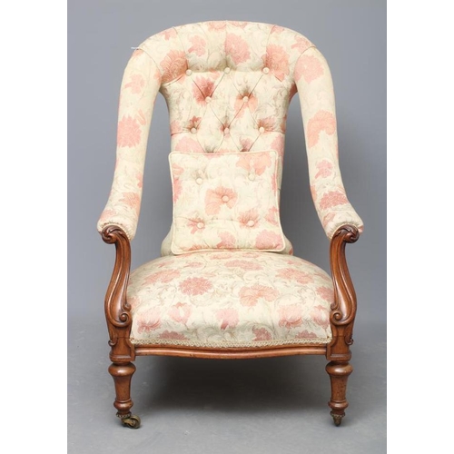 623 - A VICTORIAN WALNUT FRAMED SALON CHAIR, upholstered in a pale cream and salmon weave, arched waisted ... 