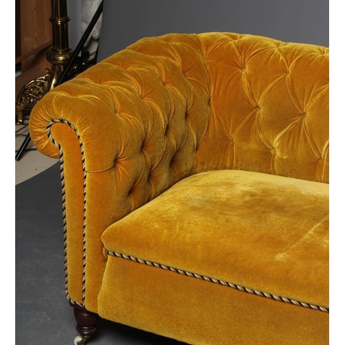 624 - A VICTORIAN WALNUT FRAMED CHESTERFIELD DROP END SETTEE button upholstered in mustard yellow velvet, ... 