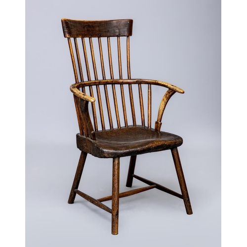 626 - A COMB BACK WINDSOR ARMCHAIR, Welsh 18th century, with curved top rail, shaped tapering arm supports... 