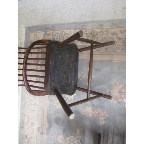 626 - A COMB BACK WINDSOR ARMCHAIR, Welsh 18th century, with curved top rail, shaped tapering arm supports... 