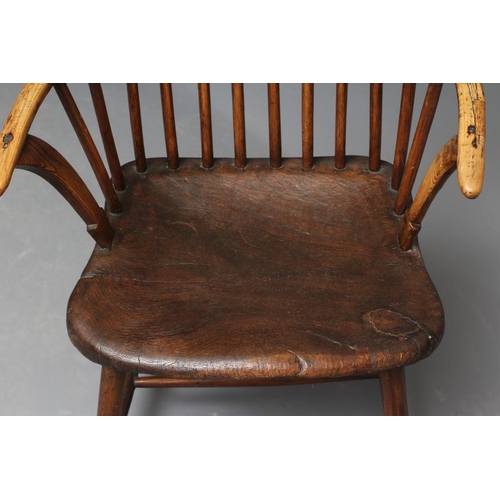 626 - A COMB BACK WINDSOR ARMCHAIR, Welsh 18th century, with curved top rail, shaped tapering arm supports... 