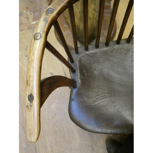 626 - A COMB BACK WINDSOR ARMCHAIR, Welsh 18th century, with curved top rail, shaped tapering arm supports... 