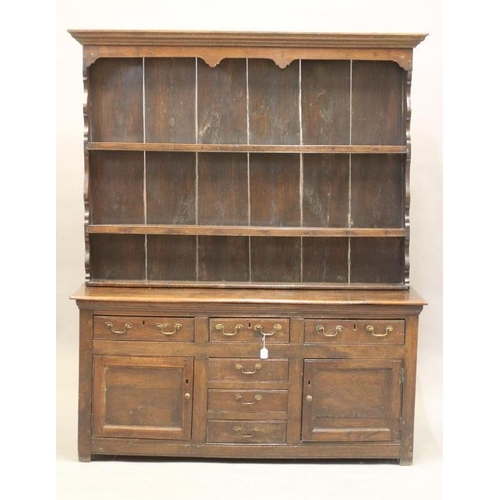 632 - AN OAK DRESSER, 17th century and later, the boarded delft rack with moulded cornice and sides and th... 