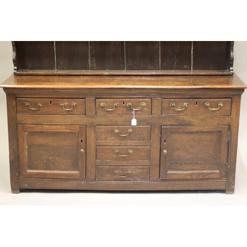 632 - AN OAK DRESSER, 17th century and later, the boarded delft rack with moulded cornice and sides and th... 