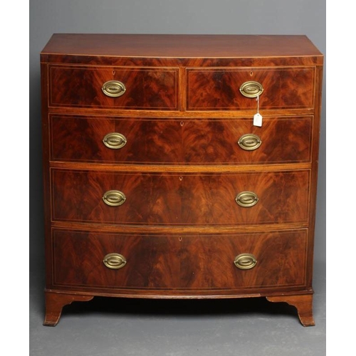 635 - A REGENCY MAHOGANY BOW FRONT CHEST, c.1800, with boxwood stringing, the caddy top over two short and... 