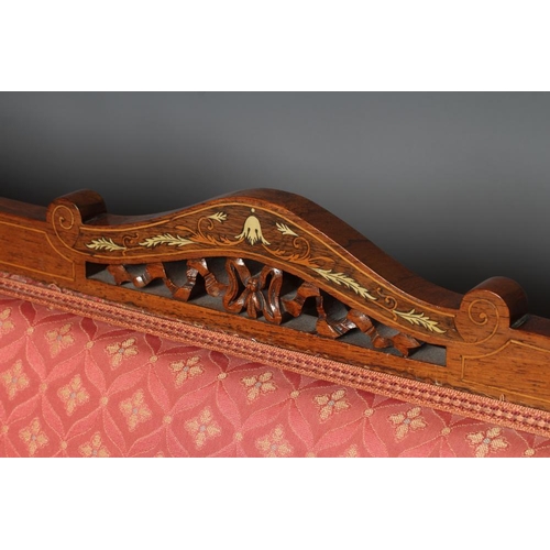 640 - A CARVED WALNUT SHOW FRAME THREE PIECE SALON SUITE, c.1900, with stringing and carved foliage and up... 