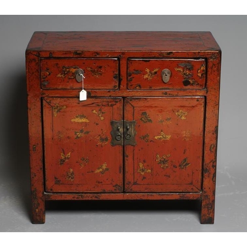 650 - A CHINESE RED LACQUERED CABINET, 20th century, gilded with butterflies, the banded top over two frie... 