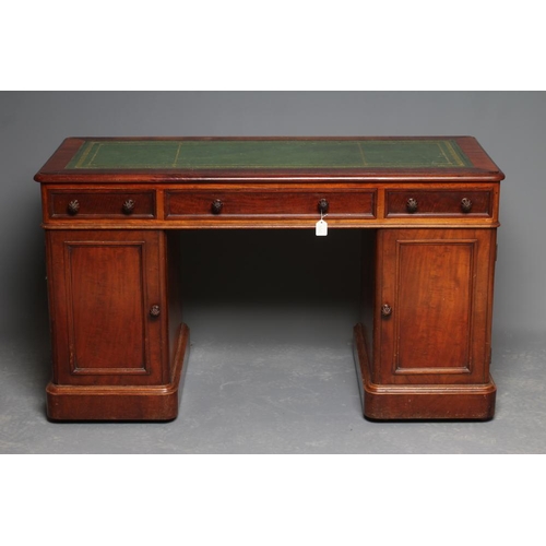 669 - A VICTORIAN MAHOGANY PEDESTAL DESK, the moulded edged rounded oblong top inset with tooled green lea... 