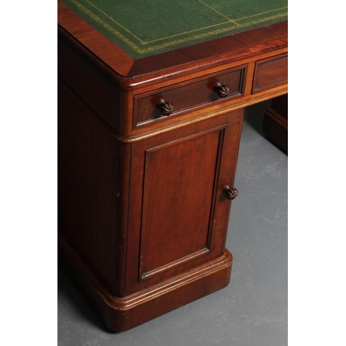 669 - A VICTORIAN MAHOGANY PEDESTAL DESK, the moulded edged rounded oblong top inset with tooled green lea... 