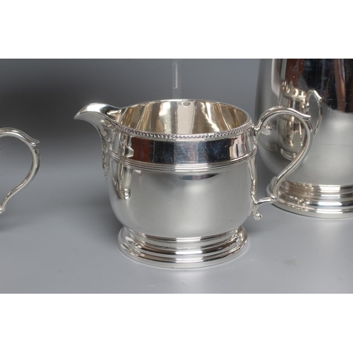 105 - A FOUR PIECE TEA SERVICE, maker Fattorini & Sons, Birmingham 1930 and 1931 (hot water jug), of squat... 