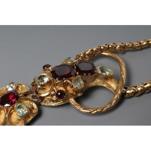 176 - A VICTORIAN GOLD SNAKE NECKLACE, the head with cabochon garnet eyes, two square cut garnets and four... 