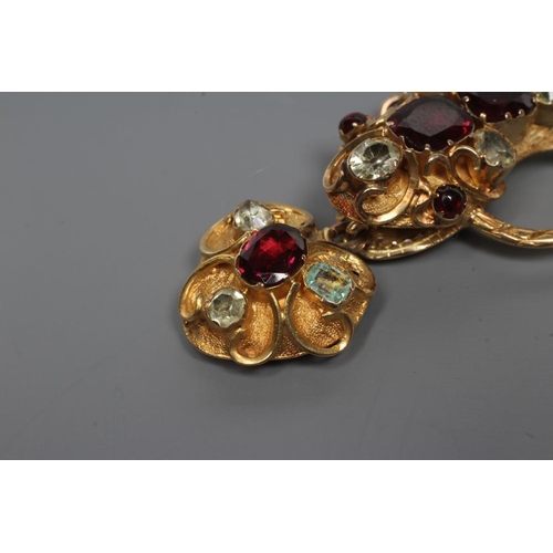 176 - A VICTORIAN GOLD SNAKE NECKLACE, the head with cabochon garnet eyes, two square cut garnets and four... 