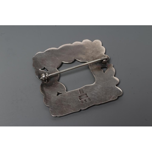 180 - A GEORG JENSEN SILVER SQUARE BROOCH designed by Arno Malinowski, cast as a recumbent deer and squirr... 