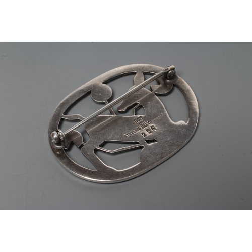 182 - A GEORG JENSEN SILVER OVAL BROOCH designed by Arno Malinowski, cast as a kneeling deer, stamped and ... 