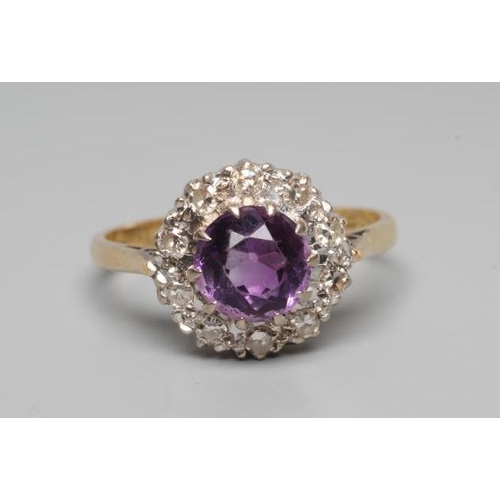 190 - AN AMETHYST AND DIAMOND CLUSTER RING, the circular facet cut amethyst claw set to a border illusion ... 